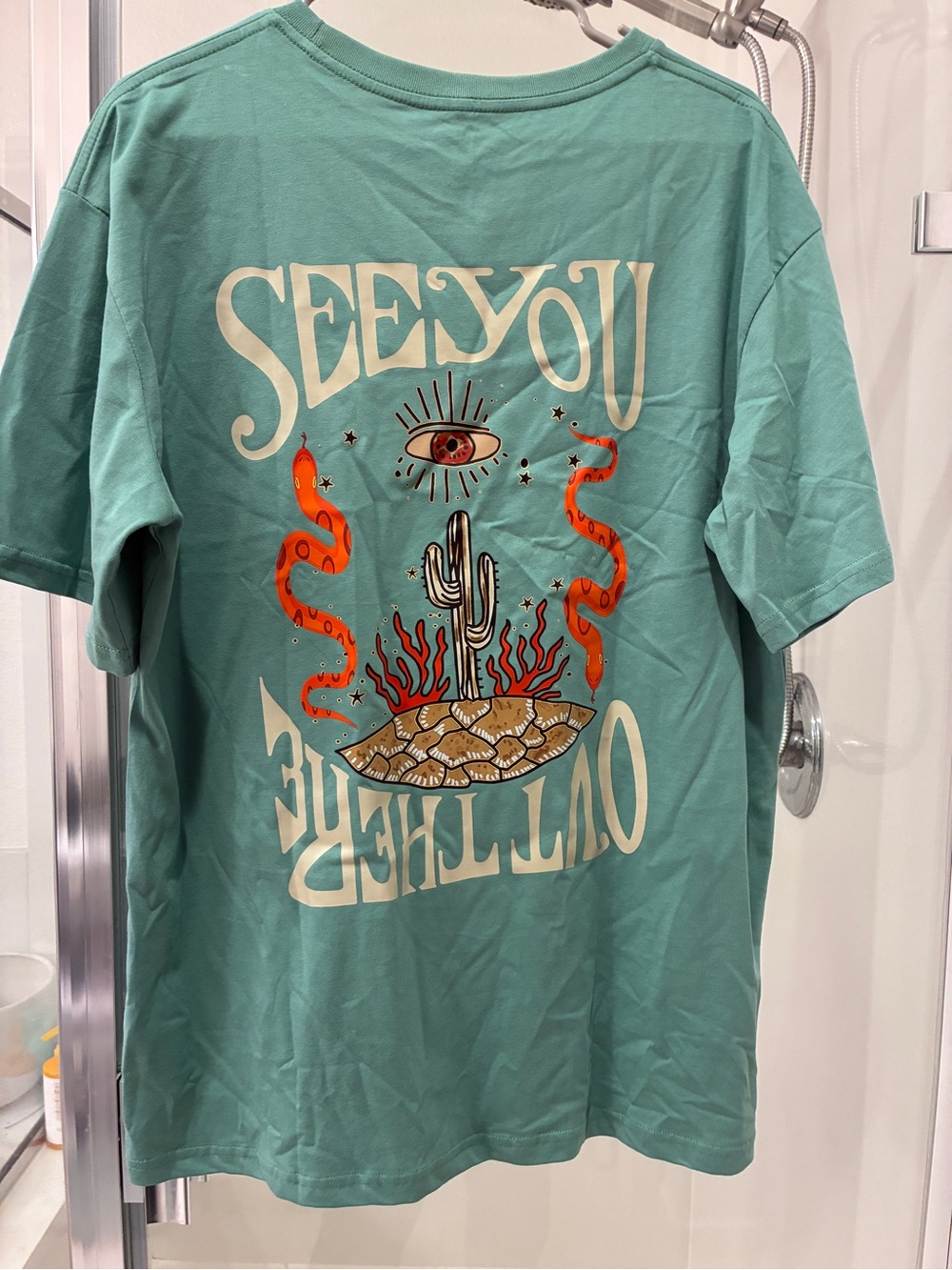 Turquoise Graphic Tee with Desert Eye & Snake Design